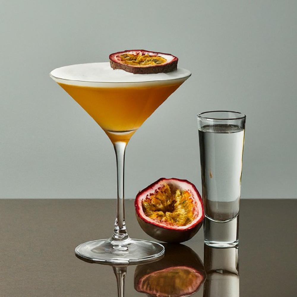 The Pornstar Martini Cocktail (cocktail, martini, vodka) - The Pornstar Martini belongs to the modern classic cocktail family, known for bold, fruity flavors. Created by bartender Douglas Ankrah in London during the early 2000s, it features passion fruit, vanilla vodka, and a side of champagne. Its provocative name and vibrant taste have made it a global favorite at contemporary bars.